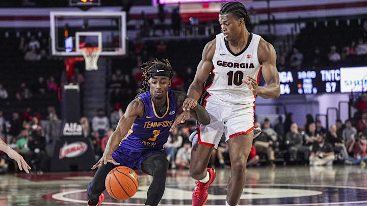 Nov 4, 2024; Athens, Georgia, USA; Tennessee Tech Golden Eagles guard Jaylon Johnson (3) dribbles against Georgia Bulldogs forward RJ Godfrey (10) at Stegeman Coliseum. Mandatory Credit: Dale Zanine-Imagn Images