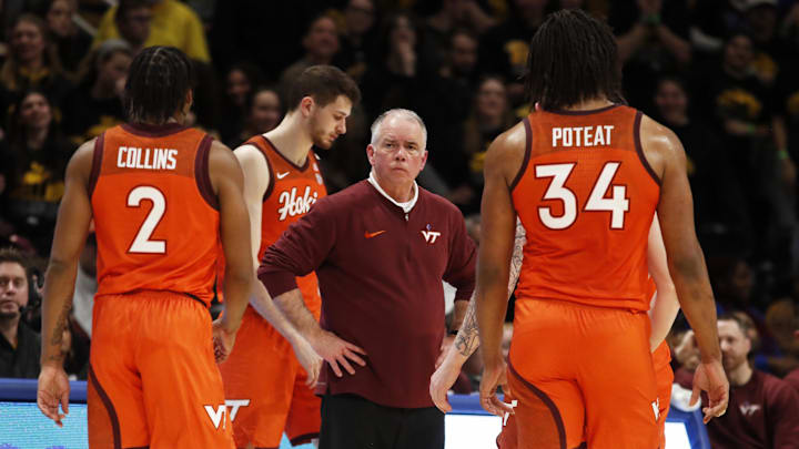 Feb 24, 2024; Pittsburgh, Pennsylvania, USA;  Virginia Tech Hokies head coach Mike Young (middle) reacts as he team returns to the bench against the Pittsburgh Panthers during the second half at the Petersen Events Center. The Panthers won 79-64. Mandatory Credit: Charles LeClaire-Imagn Images