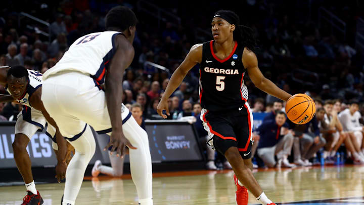 Mar 20, 2025; Wichita, KS, USA; Georgia Bulldogs guard Silas Demary Jr. (5) dribbles against Gonzaga Bulldogs forward Graham Ike (13) in the second half of a first round men’s NCAA Tournament game at Intrust Bank Arena. Mandatory Credit: Nick Tre. Smith-Imagn Images