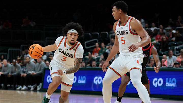Nov 23, 2025; Coral Gables, Florida, USA; Miami Hurricanes guard Tre Donaldson (3) drives to the basket against the Delaware State Hornets during the first half at Watsco Center. Mandatory Credit: Sam Navarro-Imagn Images