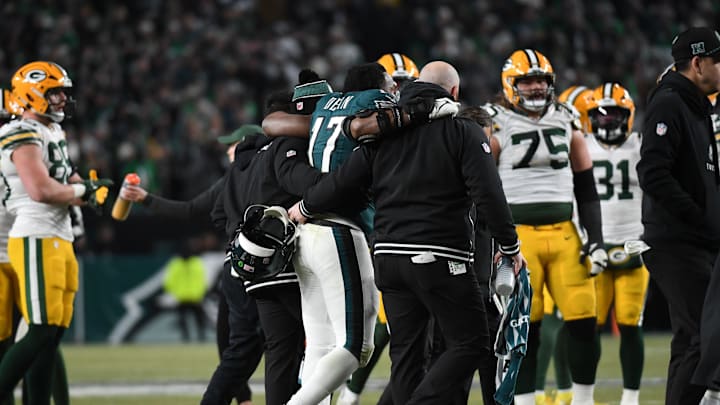 Philadelphia Eagles linebacker Nakobe Dean (17) is helped off the field against the Green Bay Packers. Philadelphia Eagles linebacker Nakobe Dean (17) is helped off the field against the Green Bay Packers.