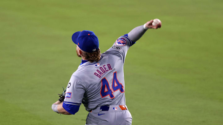 Oct 13, 2024; Los Angeles, California, USA; New York Mets outfielder Harrison Bader (44) makes a throw to home plate against the Los Angeles Dodgers in the eighth inning during game one of the NLCS for the 2024 MLB Playoffs at Dodger Stadium. Mandatory Credit: Jason Parkhurst-Imagn Images