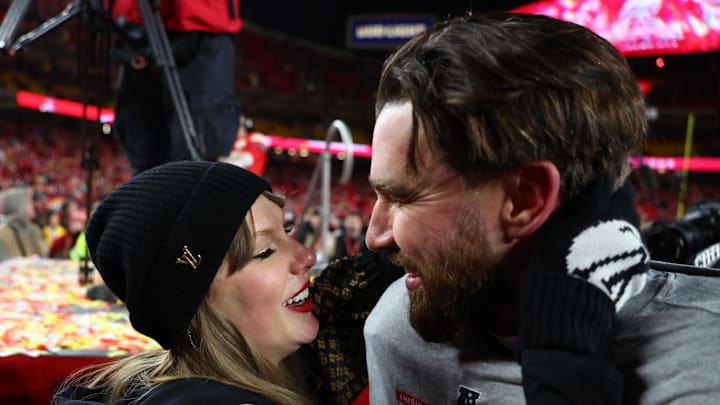 Jan 26, 2025; Kansas City, MO, USA; Recording artist Taylor Swift and Kansas City Chiefs tight end Travis Kelce (87) react after the AFC Championship game against the Buffalo Bills at GEHA Field at Arrowhead Stadium. Mandatory Credit: Mark J. Rebilas-Imagn Images Jan 26, 2025; Kansas City, MO, USA; Recording artist Taylor Swift and Kansas City Chiefs tight end Travis Kelce (87) react after the AFC Championship game against the Buffalo Bills at GEHA Field at Arrowhead Stadium. Mandatory Credit: Mark J. Rebilas-Imagn Images