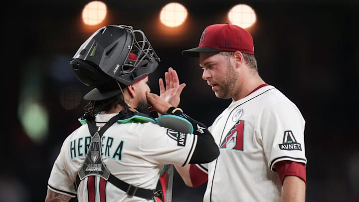 Arizona Diamondbacks pitcher Corbin Burnes (39) talks to catcher Jose Herrera (11) before being taken out of the game in the fifth inning against the Washington Nationals at Chase Field in Phoenix on June 1, 2025.