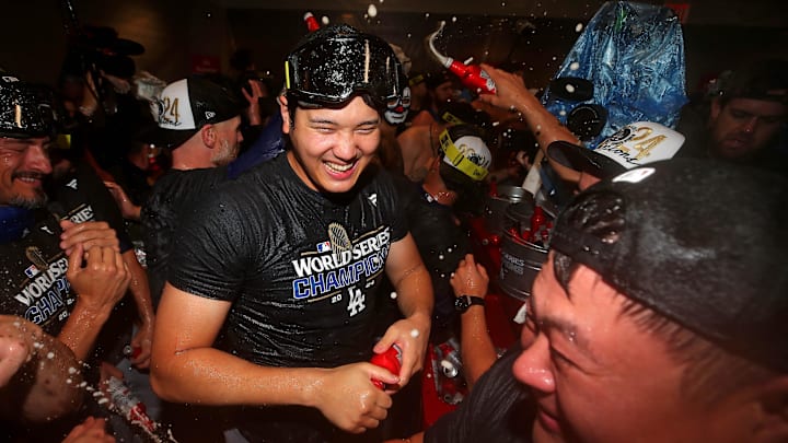 Oct 31, 2024; New York, New York, USA; Los Angeles Dodgers two-way player Shohei Ohtani (17) celebrates in the locker room after the Los Angeles Dodgers beat the New York Yankees in game four to win the 2024 MLB World Series at Yankee Stadium. Mandatory Credit: Brad Penner-Imagn Images