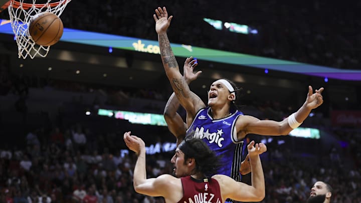 Jan 12, 2024; Miami, Florida, USA; Orlando Magic forward Paolo Banchero (5) reacts after driving to the basket against Miami Heat guard Jaime Jaquez Jr. (11) during the fourth quarter at Kaseya Center. Mandatory Credit: Sam Navarro-Imagn Images