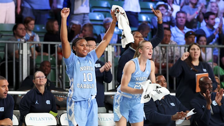 Nov 25, 2024; Paradise Island, Bahamas, BHS; North Carolina Tar Heels guard Reniya Kelly (10) and North Carolina Tar Heels guard Lexi Donarski (20) celebrate during the second half against the Indiana Hoosiers at the Atlantis Resort. Mandatory Credit: Kevin Jairaj-Imagn Images