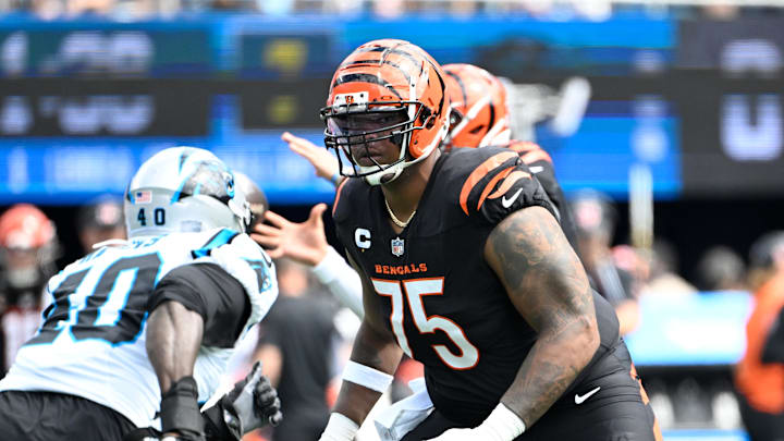 Sep 29, 2024; Charlotte, North Carolina, USA; Cincinnati Bengals offensive tackle Orlando Brown Jr. (75) blocks as Carolina Panthers linebacker Charles Harris (40) rushes in the first quarter at Bank of America Stadium. Mandatory Credit: Bob Donnan-Imagn Images