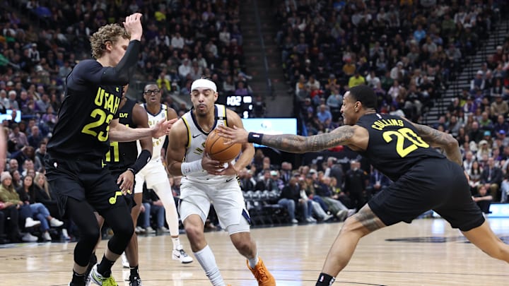 Jan 15, 2024; Salt Lake City, Utah, USA; Indiana Pacers guard Andrew Nembhard (2) drives against Utah Jazz forward Lauri Markkanen (23) and has the ball knocked away by forward John Collins (20) during the second quarter at Delta Center. Mandatory Credit: Rob Gray-Imagn Images Jan 15, 2024; Salt Lake City, Utah, USA; Indiana Pacers guard Andrew Nembhard (2) drives against Utah Jazz forward Lauri Markkanen (23) and has the ball knocked away by forward John Collins (20) during the second quarter at Delta Center. Mandatory Credit: Rob Gray-Imagn Images