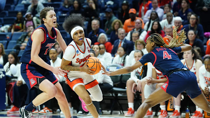 Mar 23, 2024; Storrs, Connecticut, USA; Syracuse Orange guard Dyaisha Fair (2) drives the ball against Arizona Wildcats guard Helena Pueyo (13) and guard Sophie Burrows (4) in the second half at Harry A. Gampel Pavilion. Mandatory Credit: David Butler II-Imagn Images