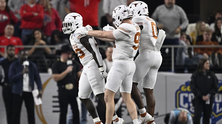 Texas Longhorns linebacker David Gbenda celebrates with linebacker Ethan Burke and linebacker Anthony Hill Jr Texas Longhorns linebacker David Gbenda celebrates with linebacker Ethan Burke and linebacker Anthony Hill Jr
