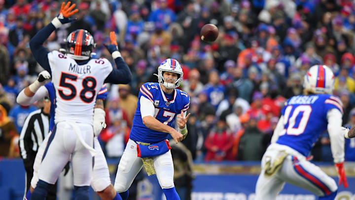 Nov 24, 2019; Orchard Park, NY, USA; Buffalo Bills quarterback Josh Allen (17) passes the ball in the direction of wide receiver Cole Beasley (10) as Denver Broncos outside linebacker Von Miller (58) pressures during the fourth quarter at New Era Field.