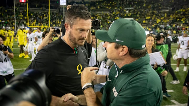 Oregon Ducks head coach Dan Lanning and Michigan State Spartans head coach Jonathan Smith shake hands as the Ducks host the Spartans Friday, Oct. 4, 2024 at Autzen Stadium in Eugene, Ore.