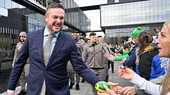 Dec 20, 2025; Eugene, OR, USA;  Oregon Ducks head coach Dan Lanning greets fans before the game against the James Madison Dukes at Autzen Stadium. Mandatory Credit: Craig Strobeck-Imagn Images