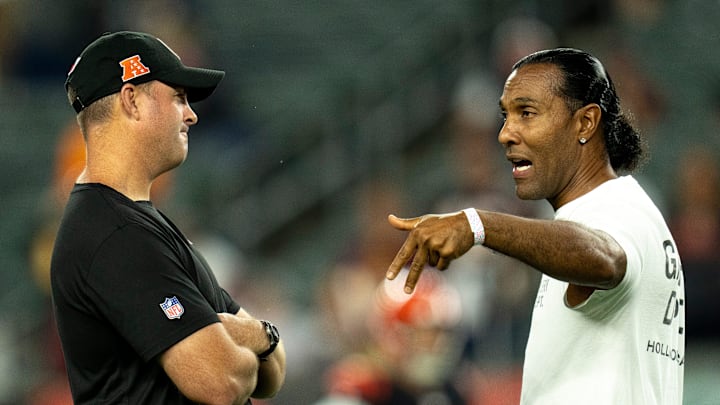 T.J. Houshmandzadeh, forner Bengal, speaks to Cincinnati Bengals head coach Zac Taylor before the NFL game at Paycor Stadium in Cincinnati on Monday, Sept. 23, 2024.