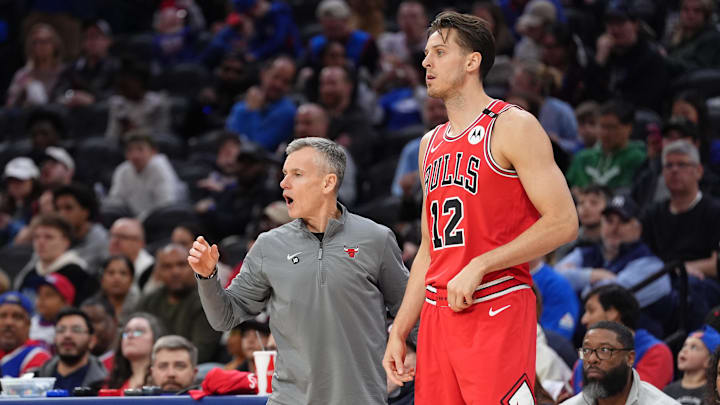 Chicago Bulls head coach Billy Donovan reacts with forward Zach Collins (12) against the Philadelphia 76ers in the third quarter at Wells Fargo Center. 