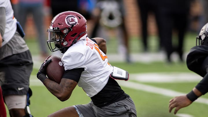 Feb 1, 2022; Mobile, AL, USA; American running back Zaquandre White of South Carolina (4) runs the ball during American practice for the 2022 Senior Bowl at Hancock Whitney Stadium. Mandatory Credit: Vasha Hunt-Imagn Images