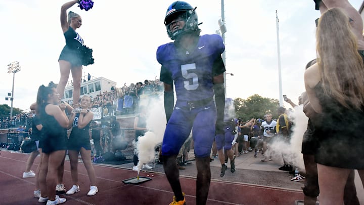 Lipscomb Academy's C.J. Jimcoily (5) runs onto the field before an high school football game against Thompson Thursday, Aug. 29, 2024, in Nashville, Tenn. Lipscomb Academy's C.J. Jimcoily (5) runs onto the field before an high school football game against Thompson Thursday, Aug. 29, 2024, in Nashville, Tenn.