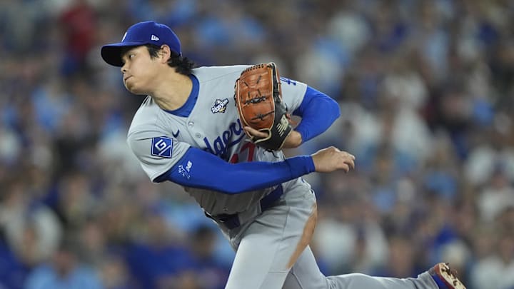 Nov 1, 2025; Toronto, Ontario, CAN; Los Angeles Dodgers two-way player Shohei Ohtani (17) pitches against the Toronto Blue Jays in the first inning during game seven of the 2025 MLB World Series at Rogers Centre. Mandatory Credit: John E. Sokolowski-Imagn Images