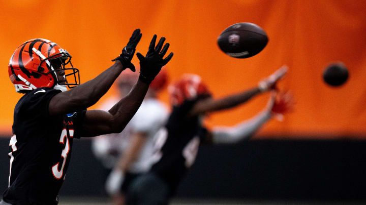 Cincinnati Bengals safety PJ Jules (37) catches a pass during an interception drill at Bengals spring practice at the IEL Indoor Facility in Cincinnati on Thursday, June 13, 2024. Cincinnati Bengals safety PJ Jules (37) catches a pass during an interception drill at Bengals spring practice at the IEL Indoor Facility in Cincinnati on Thursday, June 13, 2024.