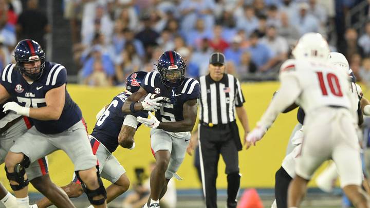 Sep 6, 2026; Nashville, Tennessee, USA; Mississippi Rebels running back Kewan Lacy (5) carries the ball against the Louisville Cardinals during the first quarter at Nissan Stadium. Mandatory Credit: Steve Roberts-Imagn Images Sep 6, 2026; Nashville, Tennessee, USA; Mississippi Rebels running back Kewan Lacy (5) carries the ball against the Louisville Cardinals during the first quarter at Nissan Stadium. Mandatory Credit: Steve Roberts-Imagn Images