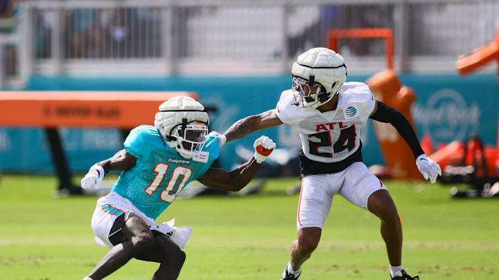 Aug 6, 2024; Miami Gardens, FL, USA; Miami Dolphins wide receiver Tyreek Hill (10) runs against Atlanta Falcons cornerback A.J. Terrell (24) during a joint practice at Baptist Health Training Complex. Mandatory Credit: Sam Navarro-Imagn Images