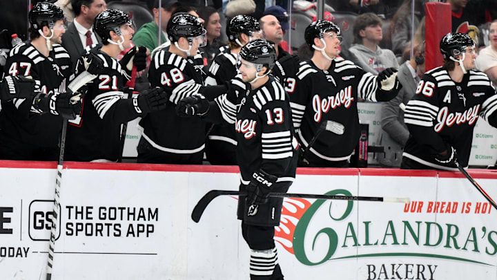 Apr 12, 2026; Newark, New Jersey, USA; New Jersey Devils center Nico Hischier (13) celebrates with teammates after scoring a goal against the Ottawa Senators during the first period at Prudential Center. Mandatory Credit: John Jones-Imagn Images