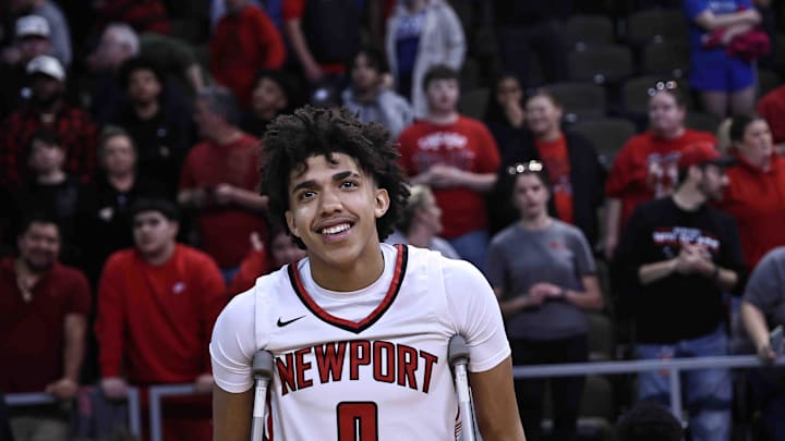 Newport's Taylen Kinney reacts after Newport's Ninth Region championship win over Cooper Tuesday, March 12, 2024. Kinney was injured in the first half.