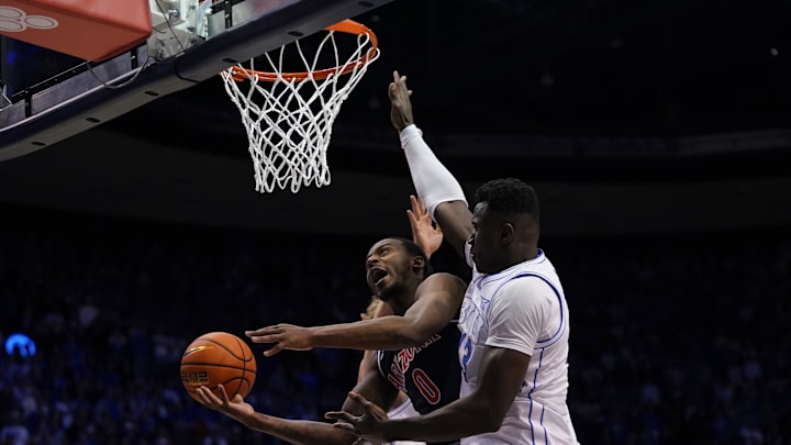 Jan 26, 2026; Provo, Utah, USA; Arizona Wildcats guard Jaden Bradley (0) drives to the basket while being defended by BYU Cougars forward Keba Keita (13) during the second half at Marriott Center. Mandatory Credit: Aaron Baker-Imagn Images Jan 26, 2026; Provo, Utah, USA; Arizona Wildcats guard Jaden Bradley (0) drives to the basket while being defended by BYU Cougars forward Keba Keita (13) during the second half at Marriott Center. Mandatory Credit: Aaron Baker-Imagn Images
