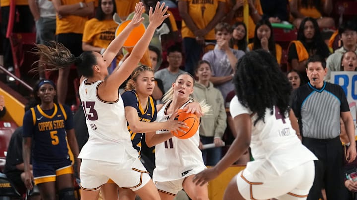 ASU Sun Devils guards Last-Tear Poa (13) and Marley Washenitz (11) defend Coppin State Bald Eagles guard Kyley Gary-Grayson (10) at Desert Financial Arena on Nov. 3, 2025. ASU Sun Devils guards Last-Tear Poa (13) and Marley Washenitz (11) defend Coppin State Bald Eagles guard Kyley Gary-Grayson (10) at Desert Financial Arena on Nov. 3, 2025.