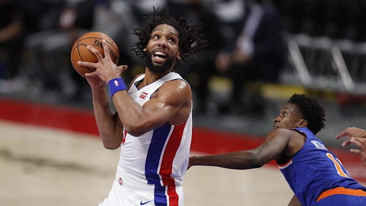 Dec 11, 2020; Detroit, Michigan, USA; Detroit Pistons center Jahlil Okafor (13) turns toward the basket against New York Knicks guard Frank Ntilikina (11) during the second quarter at Little Caesars Arena. Mandatory Credit: Raj Mehta-Imagn Images