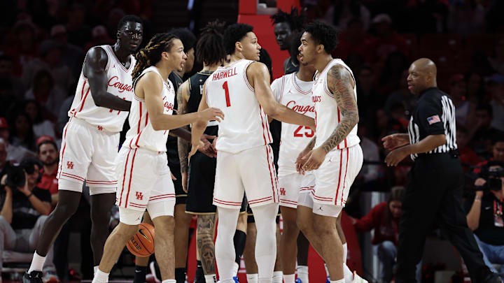 Feb 4, 2026; Houston, Texas, USA;  Houston Cougars guard Isiah Harwell (1) and teammates huddle against the UCF Knights in the second half at Fertitta Center. Mandatory Credit: Thomas Shea-Imagn Images