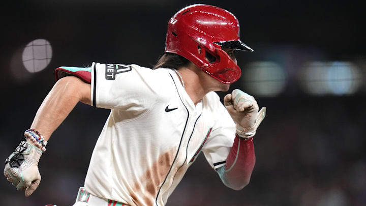 Arizona Diamondbacks Corbin Carroll (7) sprints to first base against the San Diego Padres at Chase Field in Phoenix on Sept. 29, 2024. Arizona Diamondbacks Corbin Carroll (7) sprints to first base against the San Diego Padres at Chase Field in Phoenix on Sept. 29, 2024.