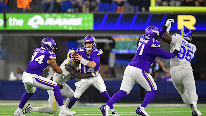 Minnesota Vikings quarterback Sam Darnold (14) is brought down by Los Angeles Rams linebacker Jared Verse during the first half at SoFi Stadium in Inglewood, Calif., on Oct. 24, 2024.
