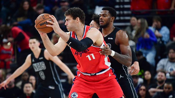 Jan 25, 2026; Inglewood, California, USA; Los Angeles Clippers center Brook Lopez (11) controls the ball against Brooklyn Nets center Day'ron Sharpe (20) during the second half at Intuit Dome. Mandatory Credit: Gary A. Vasquez-Imagn Images Jan 25, 2026; Inglewood, California, USA; Los Angeles Clippers center Brook Lopez (11) controls the ball against Brooklyn Nets center Day'ron Sharpe (20) during the second half at Intuit Dome. Mandatory Credit: Gary A. Vasquez-Imagn Images