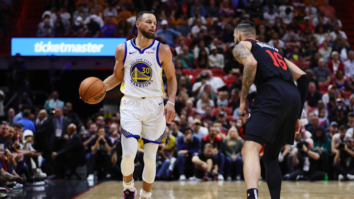 Mar 26, 2024; Miami, Florida, USA; Golden State Warriors guard Stephen Curry (30) dribbles the