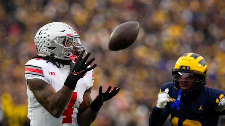 Ohio State Buckeyes wide receiver Jeremiah Smith (4) catches a pass against the Michigan Wolverines in the first half of the NCAA football game at Michigan Stadium on Saturday, Nov. 29, 2025 in Ann Arbor, Michigan. Ohio State Buckeyes wide receiver Jeremiah Smith (4) catches a pass against the Michigan Wolverines in the first half of the NCAA football game at Michigan Stadium on Saturday, Nov. 29, 2025 in Ann Arbor, Michigan.