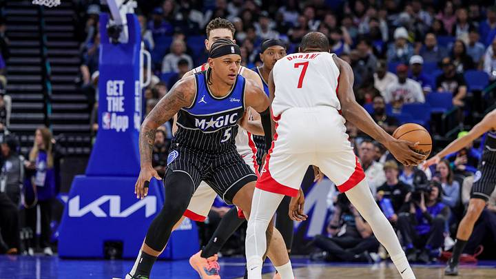 Feb 26, 2026; Orlando, Florida, USA; Orlando Magic forward Paolo Banchero (5) defends Houston Rockets forward Kevin Durant (7) during the first quarter at Kia Center. Mandatory Credit: Mike Watters-Imagn Images