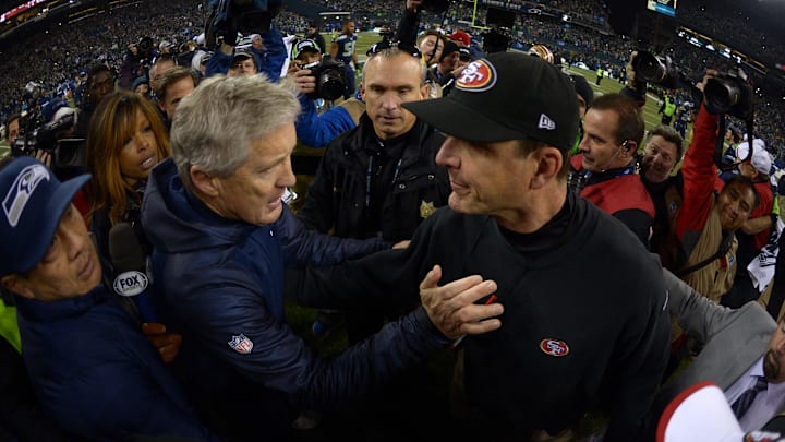 Seattle Seahawks coach Pete Carroll (left) and San Francisco 49ers coach Jim Harbaugh (right)