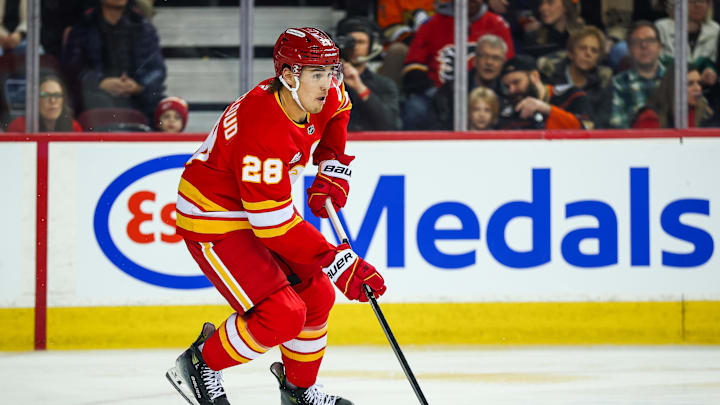 Jan 25, 2026; Calgary, Alberta, CAN; Calgary Flames defenseman Zach Whitecloud (28) skates with the puck against the Anaheim Ducks during the first period at Scotiabank Saddledome. Mandatory Credit: Sergei Belski-Imagn Images Jan 25, 2026; Calgary, Alberta, CAN; Calgary Flames defenseman Zach Whitecloud (28) skates with the puck against the Anaheim Ducks during the first period at Scotiabank Saddledome. Mandatory Credit: Sergei Belski-Imagn Images