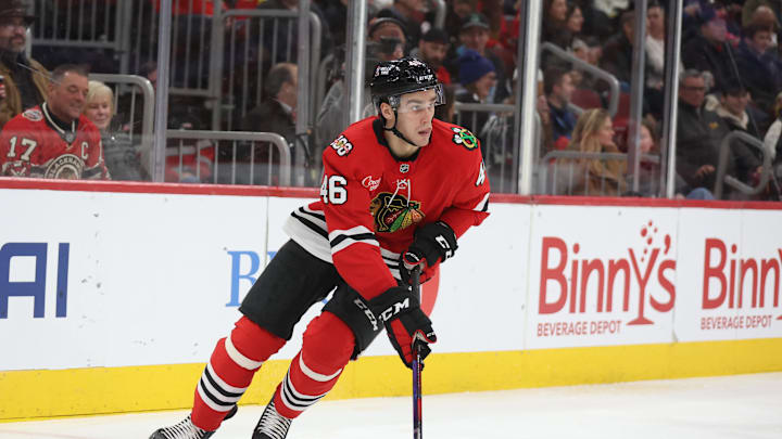Dec 30, 2025; Chicago, Illinois, USA; Chicago Blackhawks defenseman Louis Crevier (46) skates with the puck during the second period against the New York Islanders at United Center. Mandatory Credit: Talia Sprague-Imagn Images