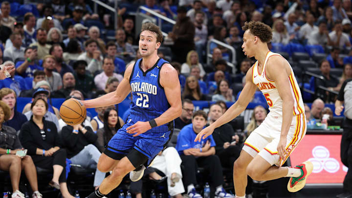 Apr 15, 2025; Orlando, Florida, USA; Orlando Magic forward Franz Wagner (22) drives to the basket past Atlanta Hawks guard Dyson Daniels (5) in the third quarter at Kia Center. Mandatory Credit: Nathan Ray Seebeck-Imagn Images