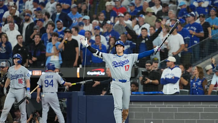 Nov 1, 2025; Toronto, Ontario, CAN; Los Angeles Dodgers two-way player Shohei Ohtani (17) reacts as second baseman Miguel Rojas (not pictured) hits a home run against the Toronto Blue Jays in the ninth inning for game seven of the 2025 MLB World Series at Rogers Centre. Mandatory Credit: Nick Turchiaro-Imagn Images