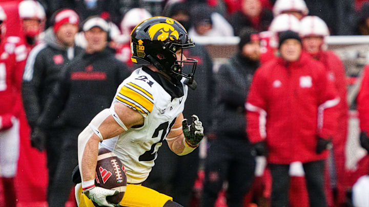 Nov 28, 2025; Lincoln, Nebraska, USA; Iowa Hawkeyes wide receiver Kaden Wetjen (21) runs against the Nebraska Cornhuskers during the third quarter at Memorial Stadium. Mandatory Credit: Dylan Widger-Imagn Images