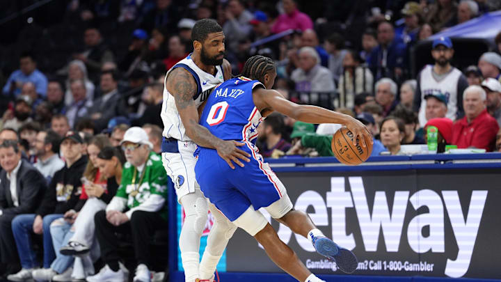 Feb 4, 2025; Philadelphia, Pennsylvania, USA; Philadelphia 76ers guard Tyrese Maxey (0) collides with Dallas Mavericks guard Kyrie Irving (11) in the first quarter at Wells Fargo Center. Mandatory Credit: Kyle Ross-Imagn Images