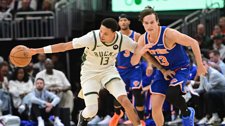 Oct 28, 2025; Milwaukee, Wisconsin, USA;  Milwaukee Bucks guard Ryan Rollins (13) steals the ball from New York Knicks guard Tyler Kolek (13) in the second quarter at Fiserv Forum. Mandatory Credit: Benny Sieu-Imagn Images
