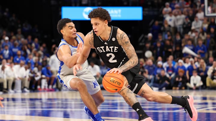 Dec 21, 2024; Memphis, Tennessee, USA; Mississippi State Bulldogs guard Riley Kugel (2) drives to the basket against Memphis Tigers forward Nicholas Jourdain (2) during the first half at FedExForum. Mandatory Credit: Wesley Hale-Imagn Images Dec 21, 2024; Memphis, Tennessee, USA; Mississippi State Bulldogs guard Riley Kugel (2) drives to the basket against Memphis Tigers forward Nicholas Jourdain (2) during the first half at FedExForum. Mandatory Credit: Wesley Hale-Imagn Images