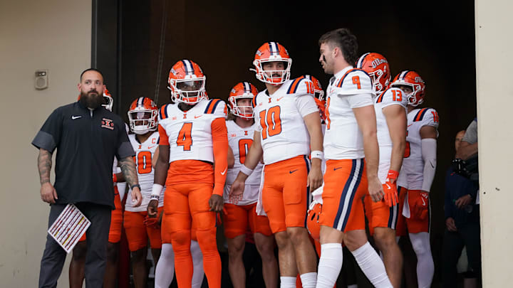 Sep 20, 2025; Bloomington, Indiana, USA; Illinois Fighting Illini quarterback Luke Altmyer (9) leads his team onto the field prior to the game against the Indiana Hoosiers at Memorial Stadium. Mandatory Credit: Robert Goddin-Imagn Images