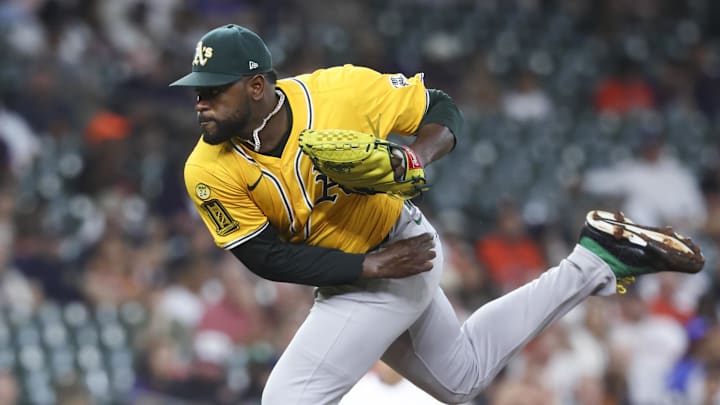Jul 24, 2025; Houston, Texas, USA;  Athletics starting pitcher Luis Severino (40) delivers a pitch during the first inning against the Houston Astros at Daikin Park. Mandatory Credit: Troy Taormina-Imagn Images