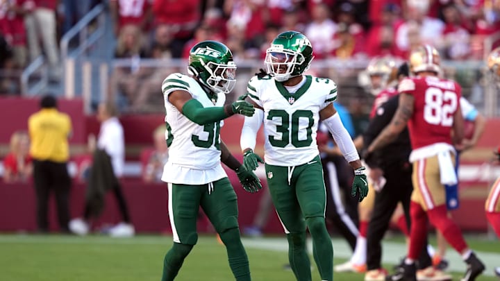 Sep 9, 2024; Santa Clara, California, USA; New York Jets safety Chuck Clark (left) congratulates cornerback Michael Carter II (30) during the first quarter against the San Francisco 49ers at Levi's Stadium. Mandatory Credit: Darren Yamashita-Imagn Images Sep 9, 2024; Santa Clara, California, USA; New York Jets safety Chuck Clark (left) congratulates cornerback Michael Carter II (30) during the first quarter against the San Francisco 49ers at Levi's Stadium. Mandatory Credit: Darren Yamashita-Imagn Images